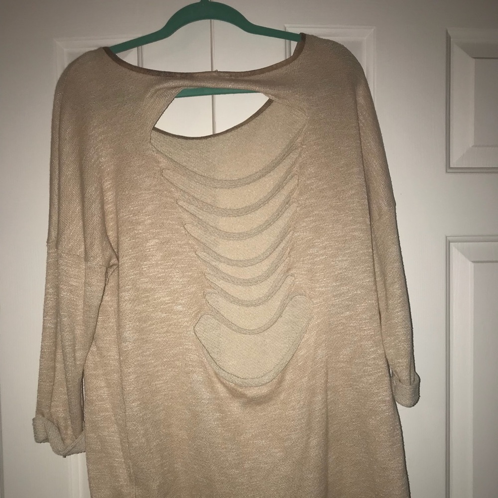 Oversized long shredded back tan blouse.